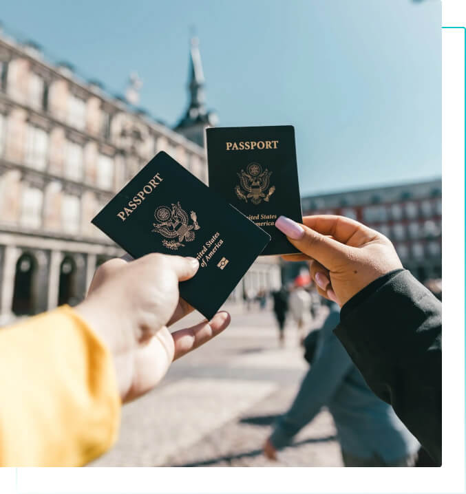 Image of two people with travel passports in their hands.